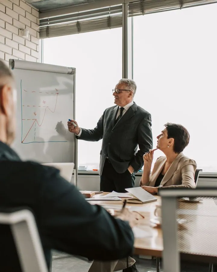 People reviewing charts during a business meeting