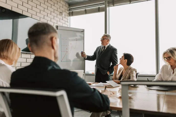 People reviewing charts during a business meeting